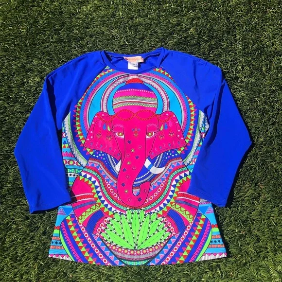 Mara Hoffman rash guard with pink ganesh against a pool blue background